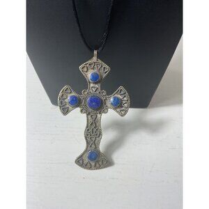 Silver Cross Pendant Necklace With Blue Stone Accents On Black Cord